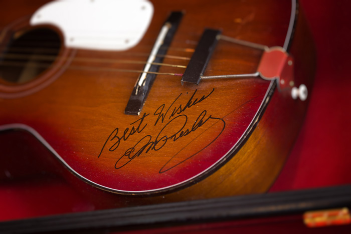An acoustic guitar autographed by the late Elvis Presley hangs at the Rock Harbor Grill. Owner David Vance calls it “the best gift I’ve ever received.”