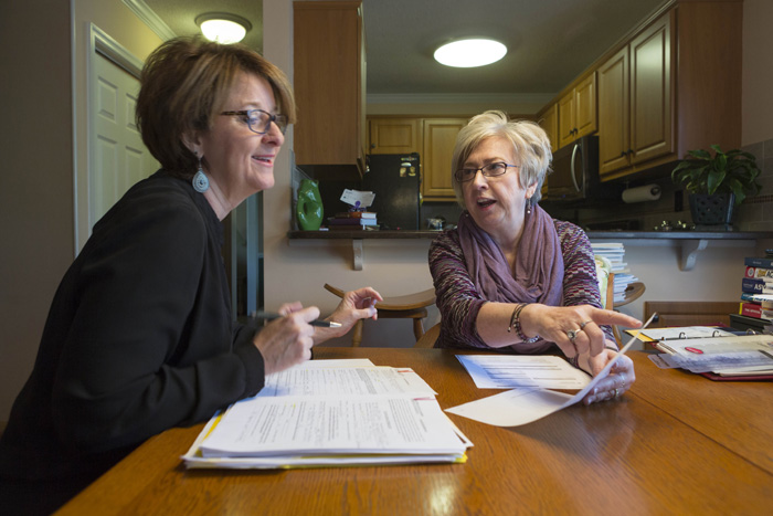 Homeowner Karen Kromenacker, right, and her husband spent a year looking for a new place to live before putting finding it in Fuquay-Varina. Their real estate agent Laura Moody, left, says homes priced at $250,000 and below sell in a couple of days; the Kromenackers’ former Cary home sold within hours of being listed.