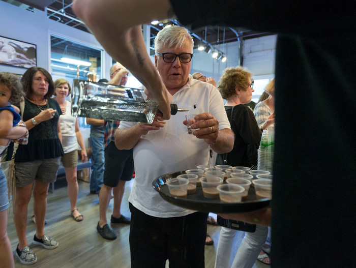 Don McAlpine of Fort Myers, Fla., tries Conniption Navy Strength Gin during a tour of Durham Distillery. Visitors can also sample Conniption American Dry Gin, cucumber vodka, and liqueurs in coffee, chocolate and mocha flavors.